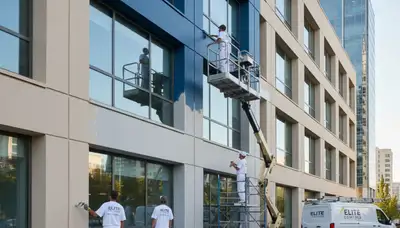 Professional commercial painters working on office exterior in Indianapolis, IN
